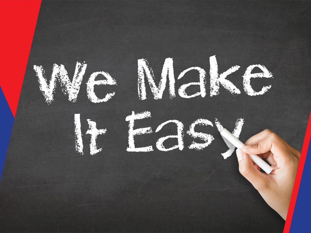 Text 'We Make It Easy' written on a chalkboard with a hand holding chalk.